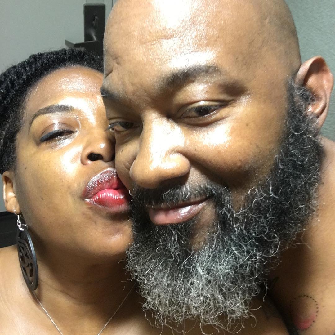 A picture of Adele Givens kissing her husband Tone.