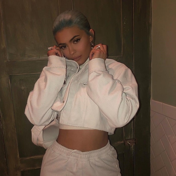 Kylie Jenner in a white jacket and sweatpant outfit