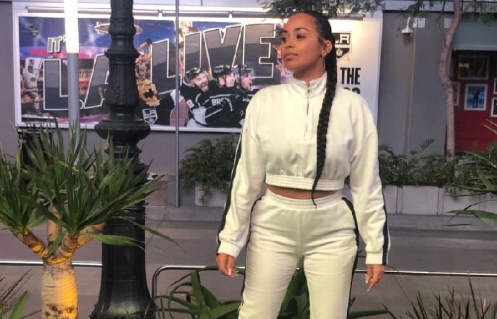 Lauren London taking a photo.