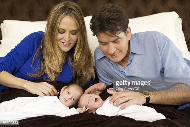 Max and his twin brother in a photo shoot with their parents.