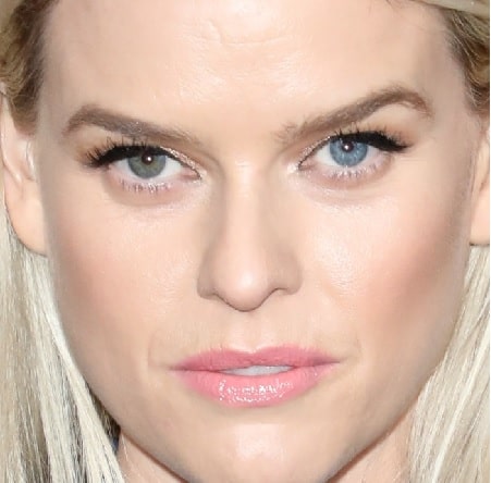 A picture of Alice Eve with two different eye color.