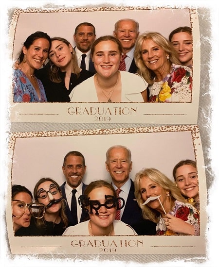 A picture of Finnegan Biden youngest sister Maisy Biden (front on white dres) on her graduation day.