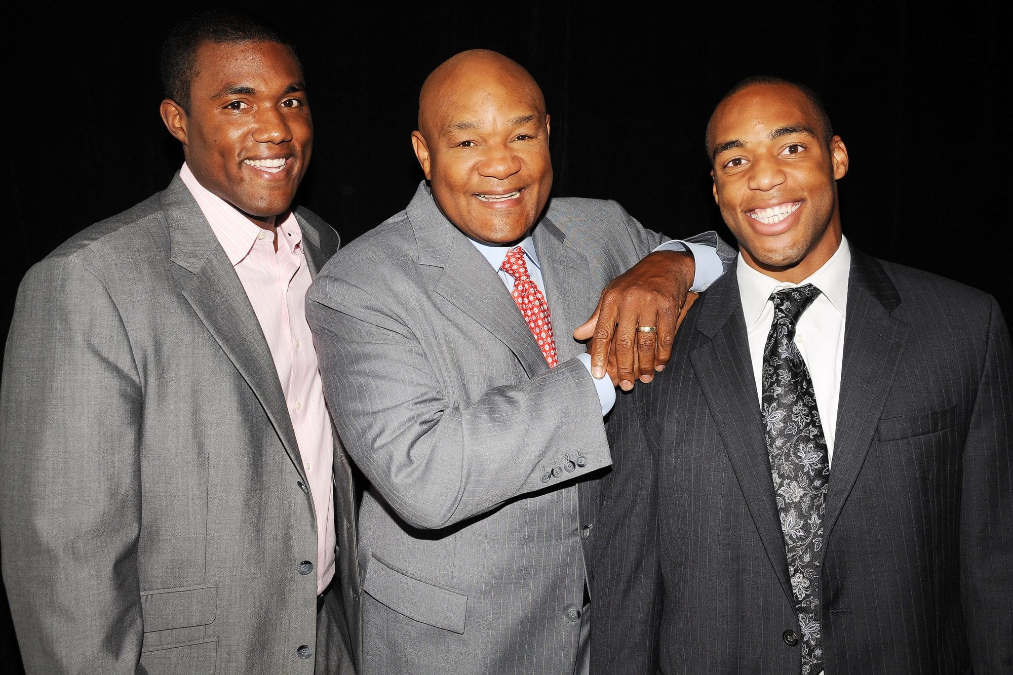 George Foreman with his sons George Foreman JR. and George Foreman IV in a suit pant