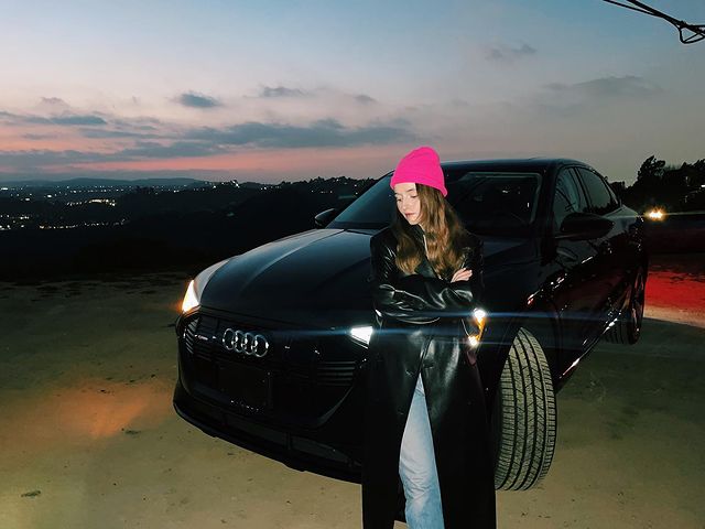 Picture of Kaitlyn Denver in fancy dress with her beautiful audi.