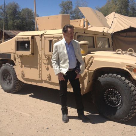 Joe Mantegna posing for a photoshoot.