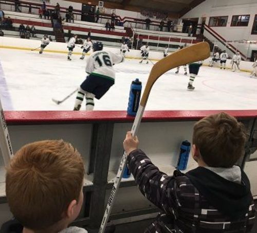 Turk Lesnar and his younger brother Duke Lesnar watching ice hockey.