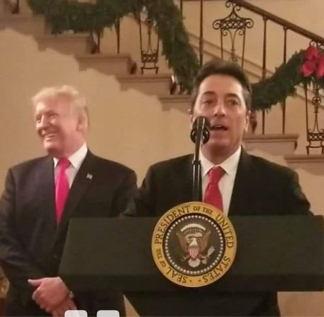 Scott Baio giving a speech in front of the mass. 