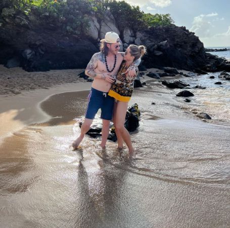 Tyler Hubbard and Hayley Stommel on the beach. 