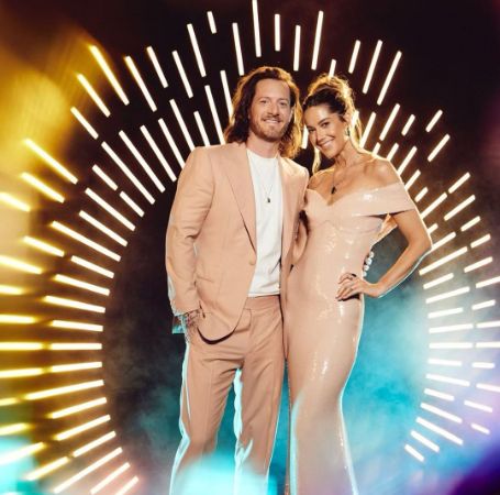 Tyler Hubbard and Hayley Stommel posing for a photo shoot.