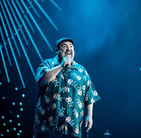 Gabriel Iglesias performing on the stage.
