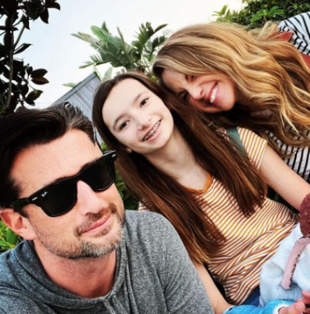 Amanda Moye Brown and Wes Brown are with their daughter.